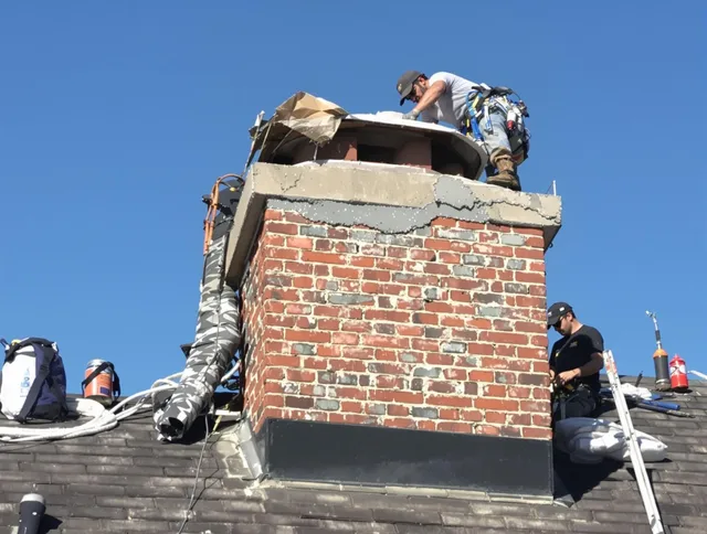 Milford Chimney Sweep installing a custom chimney crown in Milford, CT
