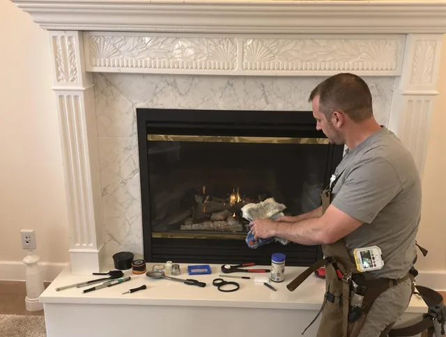 Milford Chimney Sweep performing fireplace maintenance in Milford, CT