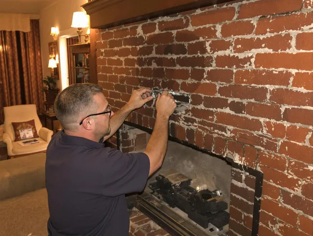 Milford Chimney Sweep expert fixing a fireplace in Milford, CT